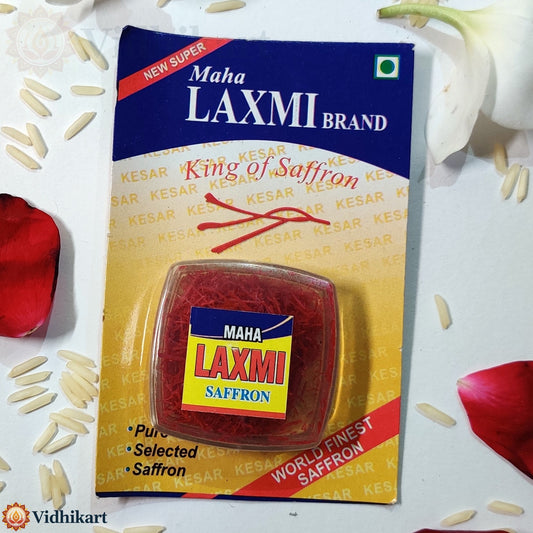 Maha Laxmi brand saffron packaging on a white background with saffron strands and rose petals.